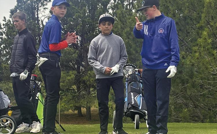 Photo by David Morris This trio of Mustangs (Roffers, Hunter, Jackson) discuss some strategy while waiting to tee off during the Western Trails Conference Invite in Kimball, Neb.