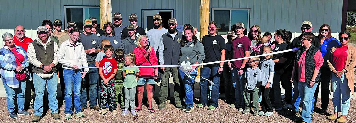Courtesy Photo Wyatt Family Meats, located north of Hay Springs, cuts the ribbon at their Open House on Saturday, Oct. 17. The business welcomed in 800+ guests for the event.