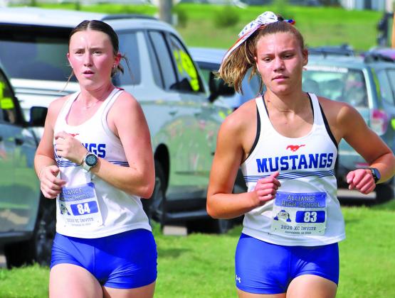 (Photo by Scott Bidroski) Junior Kynsleigh Krebs (left) and sophomore Brittney Dehning (right) have been tearing up Panhandle courses and pacing their team to four team championships this season. This past week, Krebs placed first and second in her two races with Dehning placing second and third respectively.