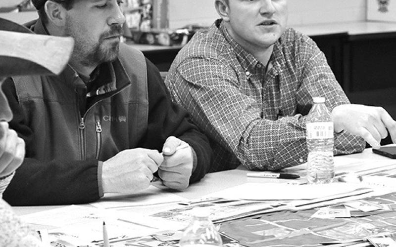 Photo by Chabella Guzman Figuring out the best manure application plan for their fields are Sam Cares, left, and Lance Chandler at the recent Nebraska Extension “Manure Better” with land application training.