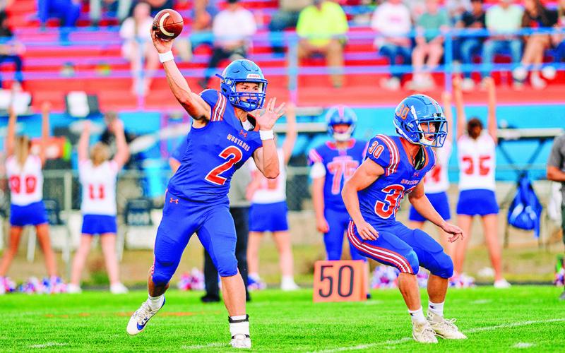 (Photo by Morgan Meisenheimer) Senior quarterback Johnny Ziller fires a pass against Chase County during the 2025 season.