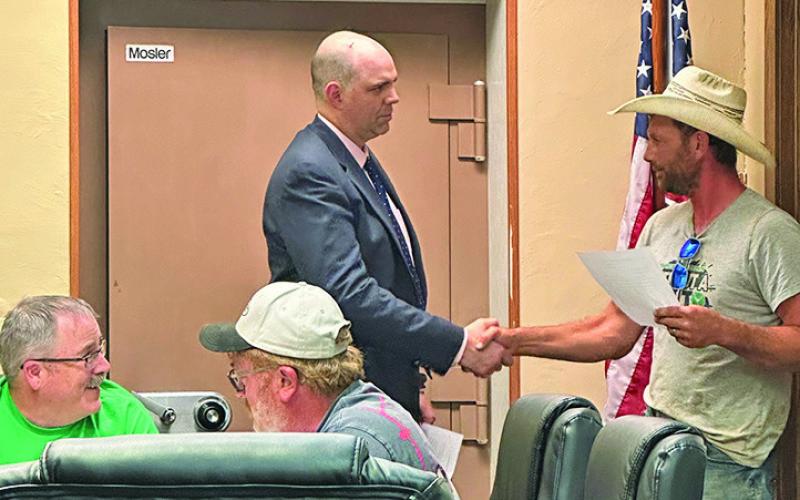 Photo by Heidi Beguin Mayor Keith Kearns watches as Brant Buettner is sworn into office by Hay Springs City Attorney Dan Skavdahl. Read the full story by Heidi Beguin on Page 4!