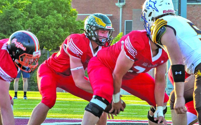 (Photo by Shontell Roseberry) Hay Springs graduate Dylan Young is under center for the Nebraska 6-Man All Star team. Young and the All Stars took on Wyoming in the annual showdown and brought home the win, 68-28. Young scored three touchdowns.