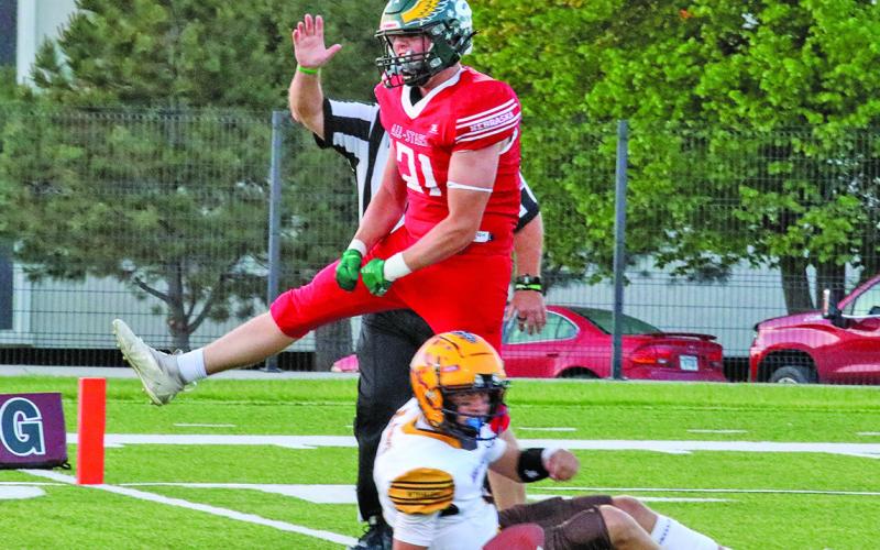 (Photo by Shontell Roseberry) Hawks graduate Talan Smith celebrates the sack of the Wyoming quarterback during the 6-man shootout hosted by Chadron State College. Smith, and his Nebraska teammates, took home the convincing victory, 68-28.