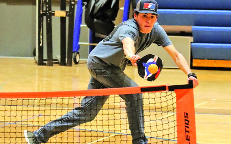 Photo by Scott Bidroski Gordon resident Kalon Sauer reaches out for a backhand return during a Pickleball match at GRHS. Sauer, among many others in the community, have jumped on board with the fastest growing sport in the U.S.