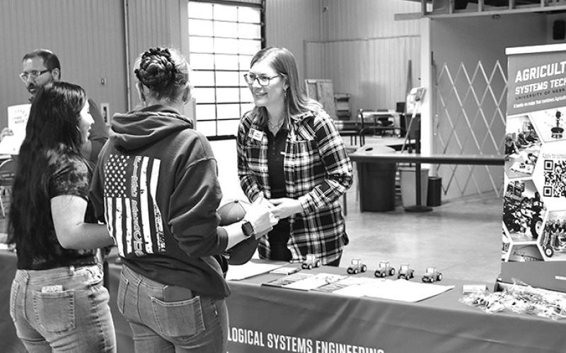 Photo by Chabella Guzman University of Nebraska-Lincoln Jenny Keshwani, a science literacy specialist, chats with students at a November career day in Scottsbluff.