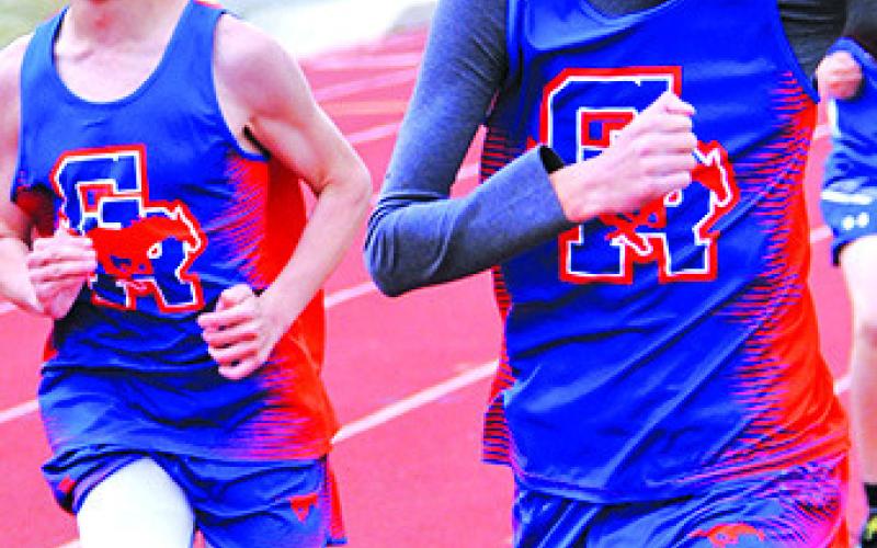 Photo by Chris Heiser Mustangs Draegon Leonard and Aiden Heiser keep their eyes on the prize in Lusk, Wyo.