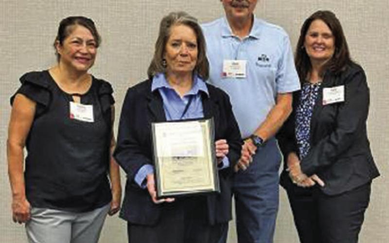 Courtesy Photo Jonnie Kusek, holding the award, receives recognition for her and her staff’s efforts in providing transportation services in Sheridan County in 2022. The 164% increase of ridership in 2022 was the highest increase among rural Nebraska public transit systems.