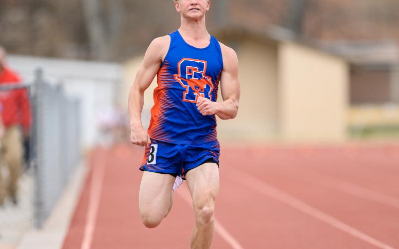 (Photo by Morgan Meisenheimer) Freshman Asa Funk glides to the finish during the 100 meter race at the Binfield Invitational.