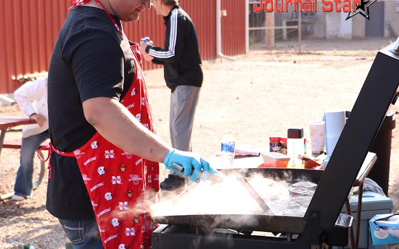 (Photo by Scott Bidroski) Gordon resident Brady Kersey volunteered his grilling skills for the Gordon Theatre event. The hamburgers served were a delicious addition to the evening's festivities.