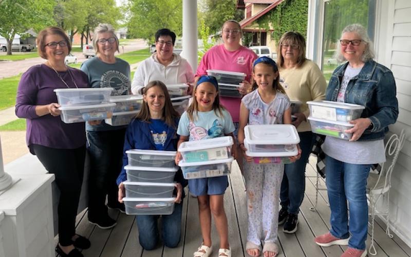 (Courtesy Photo) Members of Delta Kappa Gamma donated grooming kits which were delivered to schools in Gordon, Rushville, Hay Springs, and Chadron during the month of June. Those pictured above include: Front row: (L-R) Gordon-Rushville Public Schools Nurse Ashlei Tausan, Karley Tausan, and Grace Tausan. Back row: (L-R) Jean Hensley, Jolee Nielsen, Kay Kruger, Shayley Kersey, Sandi Muirhead, and Ann Petersen.