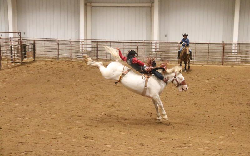 (Photo by Con Marshall) Merriman cowboy Garrett Shadbolt rides in the Coffee Pavilion at Chadron State College a couple of weeks ago. Shadbolt is headed to the Wrangler National Finals Rodeo in Las Vegas in early December.