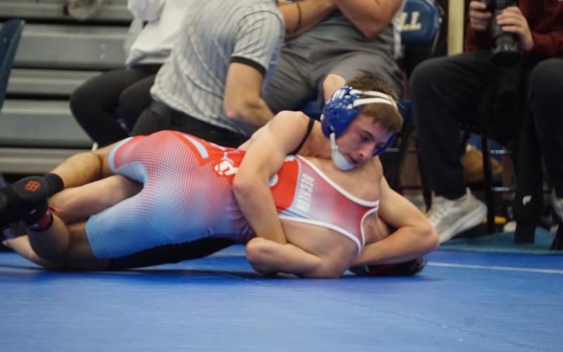 (Photo by Michele Heck) Freshman Kray Otte works his opponent during the O’Neill Invite. Otte would finish in second place in the 106 bracket.