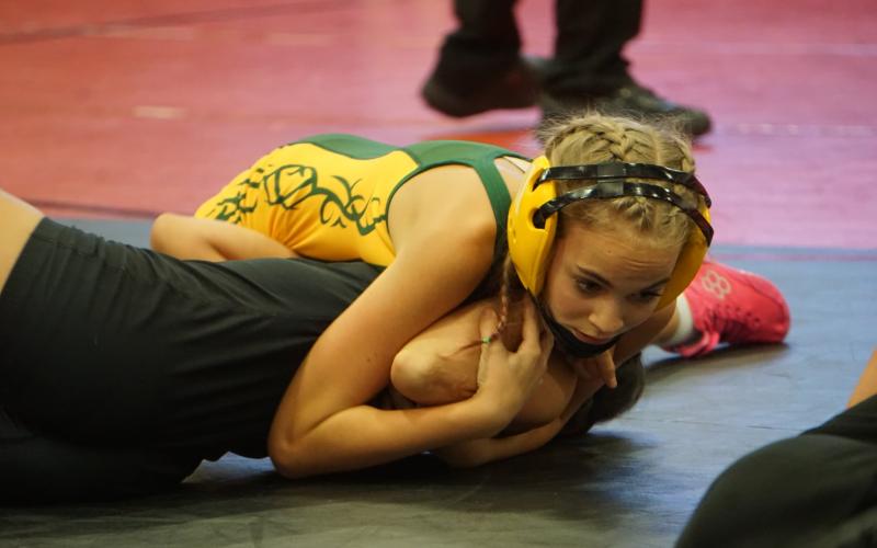 (Photo by Michele Heck) Hawks freshman Tabby Schiaffo works her opponent to her back during the Chadron Girls Invite on Thursday, December 4 to begin the season.