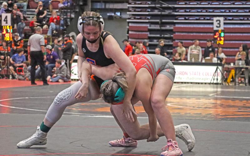 (Photo by Scott Bidroski) Kirsten Heck gains position on her opponent to set her up for the take down.
