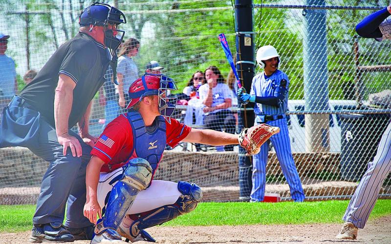 (Photo by Richae Malara) Sophomore Tripp Buettner readies to receive the pitch from his pitcher during a contest against the Alliance Spartans. Buettner and the Juniors are eight games into their 2025 season with more on tap for this week.