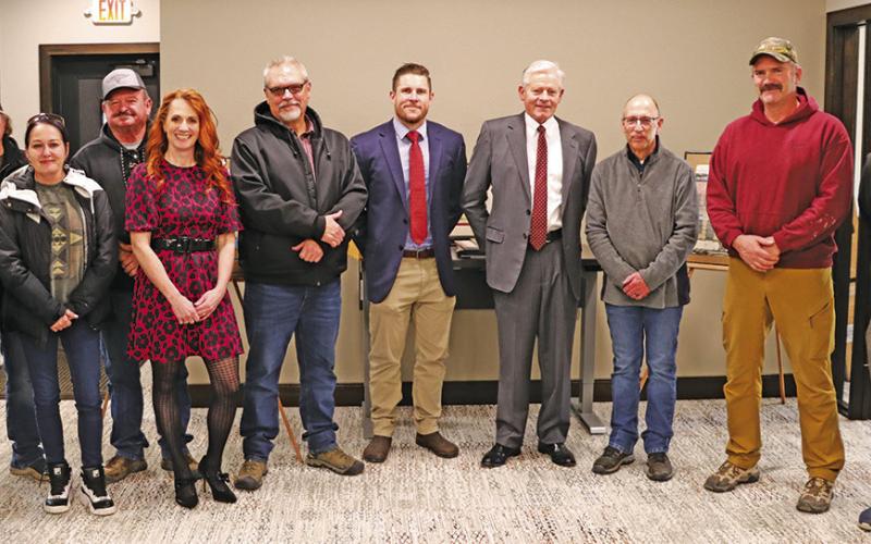Photo by Scott Bidroski Many of the key players to the successful process to add a new building to The First National Bank of Gordon stopped for a photo during the Open House on Wednesday, December 18. Those pictured include: (L-R) Vinnie Puckett, Randy Puckett, Tess Puckett, Rusty Puckett, Courtney Johnson, John Reed, Cornelius Ray, Will Isham, Glen Spaugh, Chad Kratovil, and Kim Rosane. Not pictured: Nick Burns.