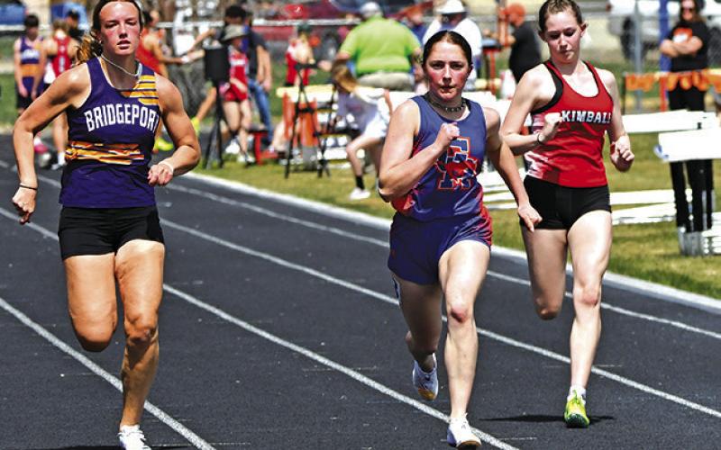 Photo by Melissa Grover Sophomore Kylie Goings pushes for the finish line during the 100 meter race at the Western Trails Conference Invitational.