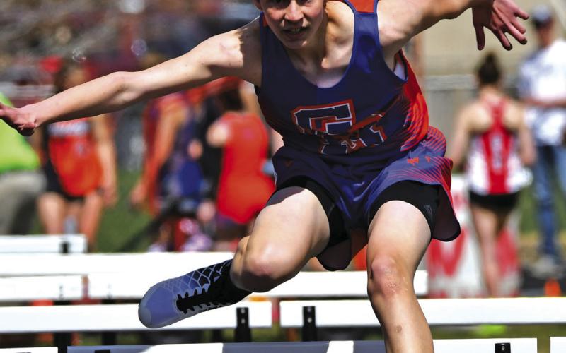 Photo by Melissa Grover Freshman Cameron Sandoz clears the hurdle during the 110m hurdle event on Saturday, April 13.