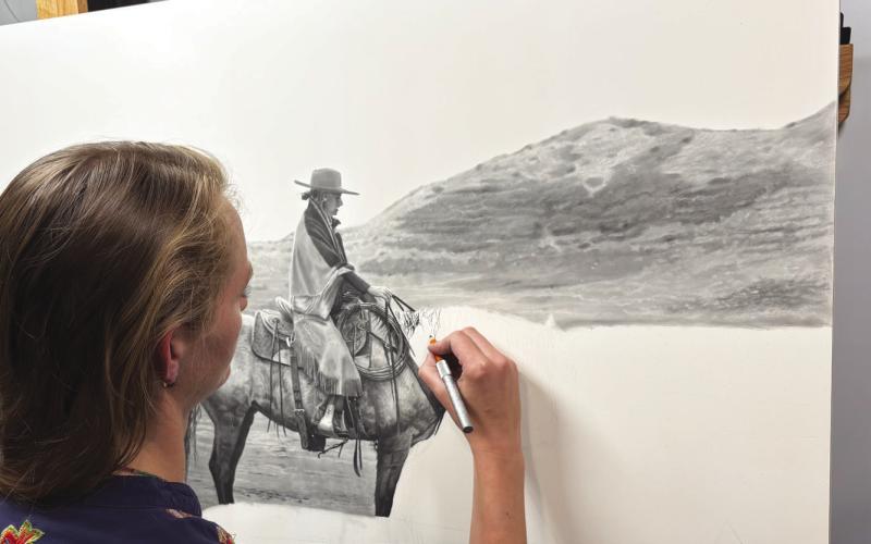 (Photo by Lisa Hare) Her latest piece, depicting a western woman on horseback in the Sandhills, is meant to be a “restful image,” according to the artist.