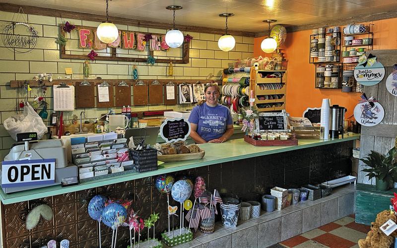 Photo by Scott Bidroski New Piece O Cake owner Caydence Bailey offers fresh baked donuts each morning, in addition to the cakes, floral and gifts.