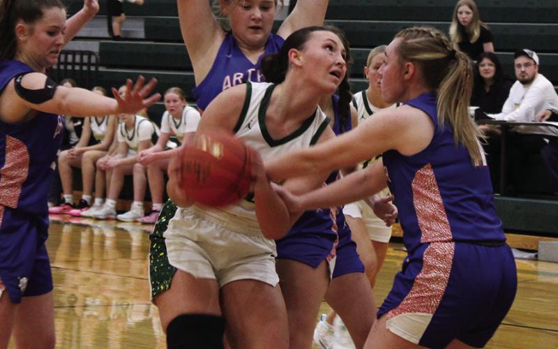 (Photo by Jessica Mintken) Senior Mya Turman pushes through the Arthur County defense in the 59-32 Hawks win on Saturday, December 6.