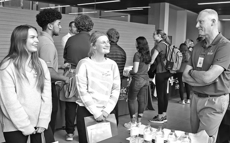 Photo by Erika Pritchard, UNK Communications Robert Dyer, CEO of Cozad Community Health System, meets with health science students Tuesday during the Hospital Partners Networking Event at UNK.