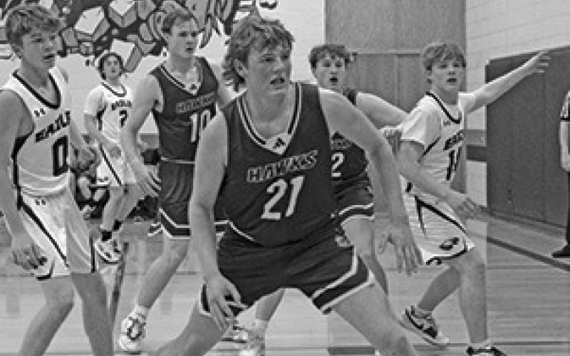 Photo by Jessica Mintken Junior Talan Smith defends against the Garden County Eagles. Smith would led the Hawk offense in this one, pouring in 18 points.