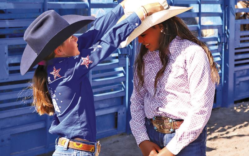(Photo by Scott Bidroski) Kamille Kruger (right), pictured here with outgoing Princess Tenley Ostrander, was crowned the 2025 SCF&amp;amp;R Princess at the Junior Rodeo on Sunday, July 20. Kruger will now carry the title for the next year and represent Sheridan County at rodeo events throughout her tenure.