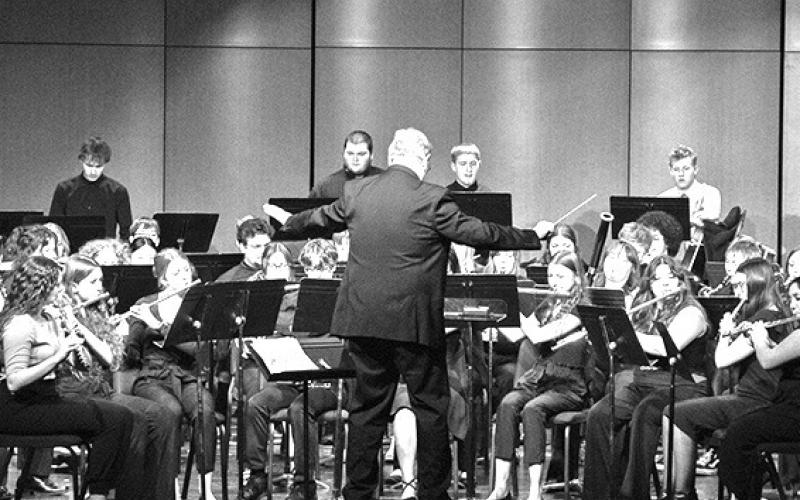 Photo by Tena L. Cook, Chadron State College High Plains Band and Choir Festival Guest Conductor Dr. Frank Tracz, Professor of Music and Director of Bands at Kansas State University, leads the Honor Band in its final performance Feb. 6, 2024, in Memorial Hall’s Auditorium.