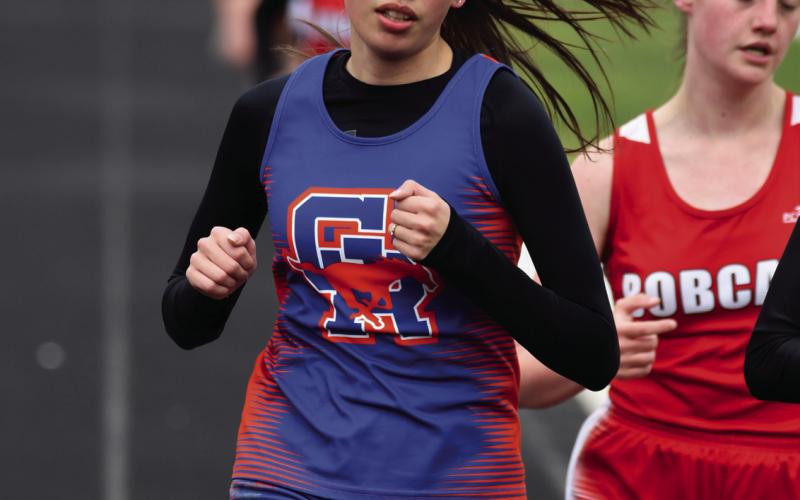Photo by Melissa Grover Senior Tyrah American Horse finishes the 1600 meter run strong ahead of her opponents at the C-9 District track meet in Bayard to earn that coveted spot at State.