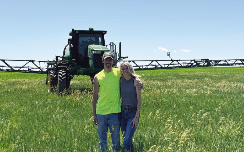 (Photo by Lisa Hare) Marc and Halley Sandberg of Hay Springs work their farm together, utilizing John Deere’s GreenStar Technology for much of the management for their operation.