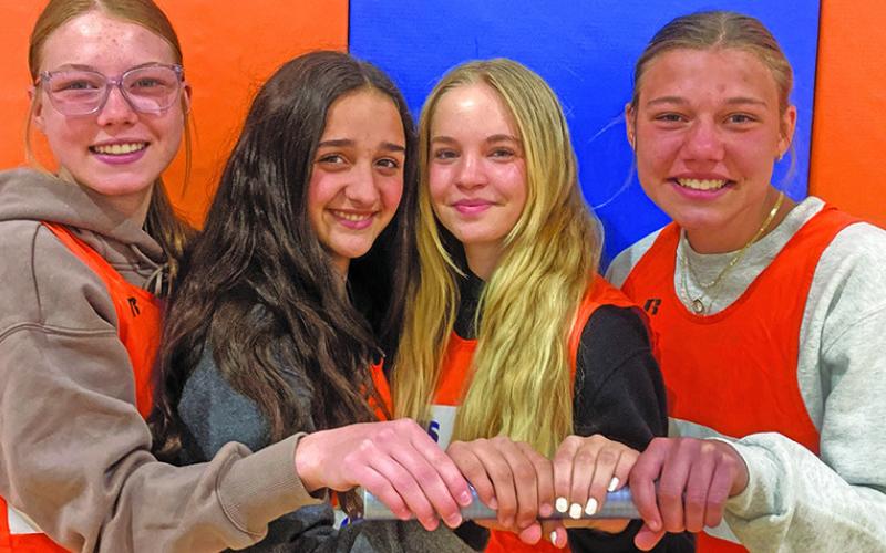 Courtesy Photo The 4x400 meter relay team of (L-R) Kennedy Kearns, Bristol Sterkel, Grace Freeseman, and Brittney Dehning set the Western Trails Conference meet record on Thursday, April 17 with a time of 4:37.96.