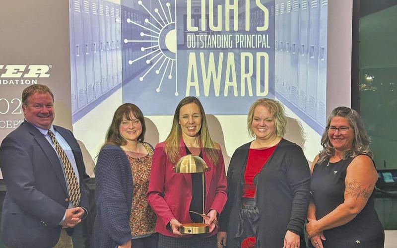(Courtesy Photo) Gordon Elementary Principal Robin Johnson accepts her Outstanding Principal Award on Thursday, October 30. Joining her for the ceremony were staff members Troy Dehning, Stormy Hunter, Lynn Schott, and Shelly Hardin.