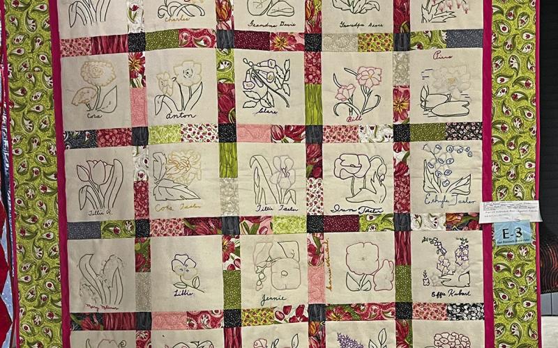 (Courtesy Photo) The finished quilt is proudly displayed with all 25 hand embroidered squares that a group of volunteers in Sheridan County brought back to life in this beautiful quilt.