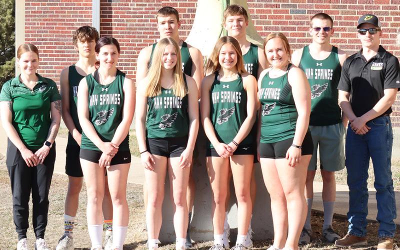 The 2024 Hay Springs Hawks Track &amp;amp; Field team. Pictured: (L-R) Head Coach Frankie Johnson, Parker Wellnitz, Adrianna Hafner, Reese Varvel, Dylan Raymer, Alaina Raymer, Gage Mintken, Josie Kelly, Mason Albrecht, and Assistant Coach Charles Twarling. Photo by Scott Bidroski
