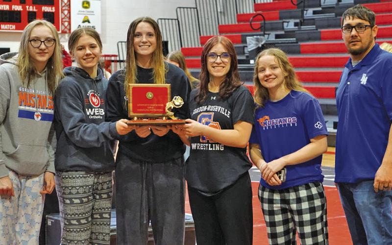 (Photo by Michele Heck) The Gordon-Rushville Wrestling Girls Wrestling team took home the first place trophy from the Ainsworth Tournament on Friday, January 31. Those pictured include: (L-R) Stormy Tesch, Jenifer Banister, Kirsten Heck, Lainey Fillmore, Madyson DeHart-Harris, and Coach Jose Campos.