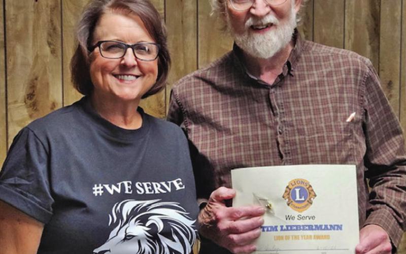Courtesy Photo Lions Club President Jean Hensley presented the Lion of the Year Award to Tim Liebermann on June 10.