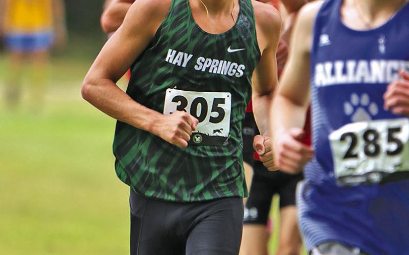 (Photo by Scott Bidroski) Senior Parker Wellnitz keeps his eyes on the front of the pack during the Panhandle Classic on August 28. Wellnitz would finish in sixth place overall.