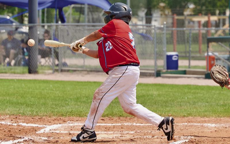(Photo by Richae Malara) Regulator Prep player Jacobi Rossman rips one into play against Kimball on Saturday, June 22.