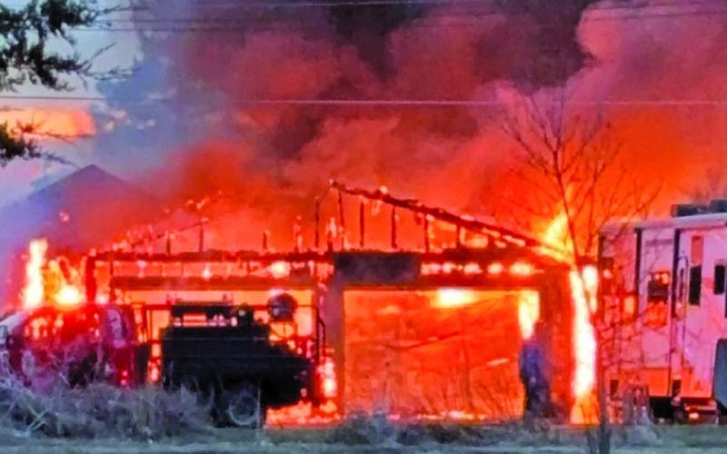 Courtesy Photo The property at 506 Sprague St. in Rushville was the site of a fire on Thursday, April 4. The garage, which is the structure in the front of the photo, was a complete loss but the first responders were able to limit damages to neighboring buildings and the main house.