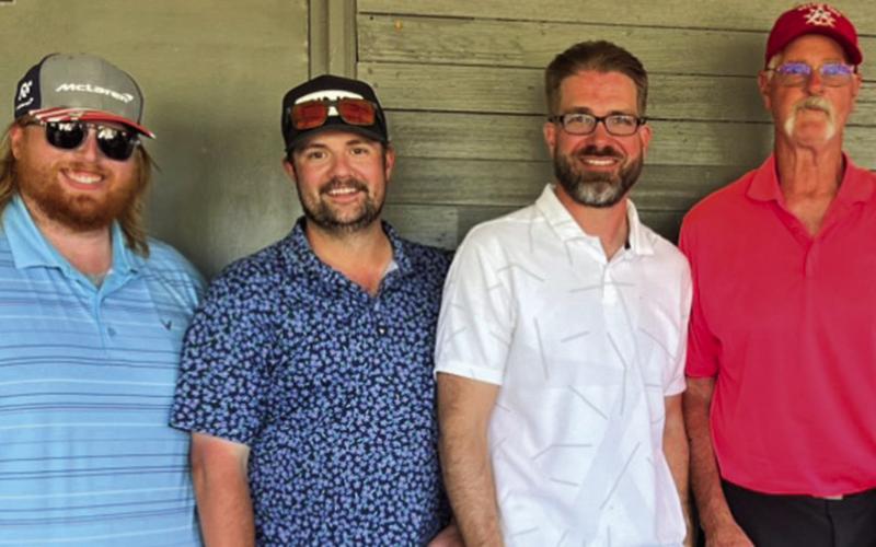Courtesy Photo CARE Tournament Men’s Division winners (L-R) Will Wacker, Rob Doyle, David Morris, and Keith Mills.