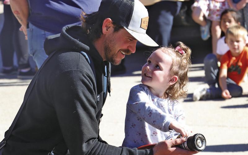 (Photo by Scott Bidroski) It was Fire Prevention Week across Sheridan County and firefighters like Lane Haller, pictured above, spent time with students. See more photos on Page 4!