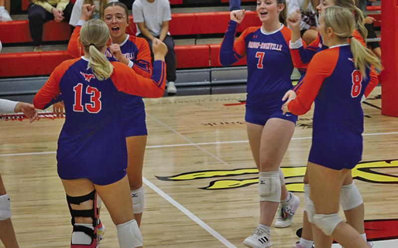 Photo by Michele Heck The Mustangs celebrate an ace during the match against Chadron on Thursday, September 4.