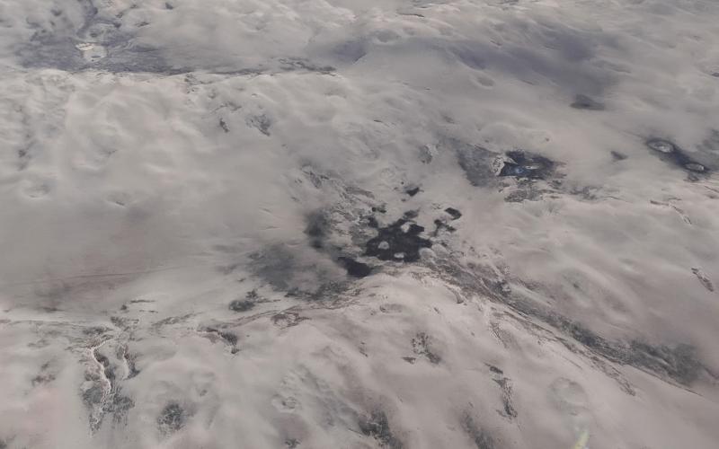 (Photo by Les Hare) A recent aerial photo taken 7,000 feet above the tragic remains of a wide expanse of the Sandhills reveals mile after mile of bare and blowing sand in the aftermath of the wildfires that ravaged more than 800,000 acres.