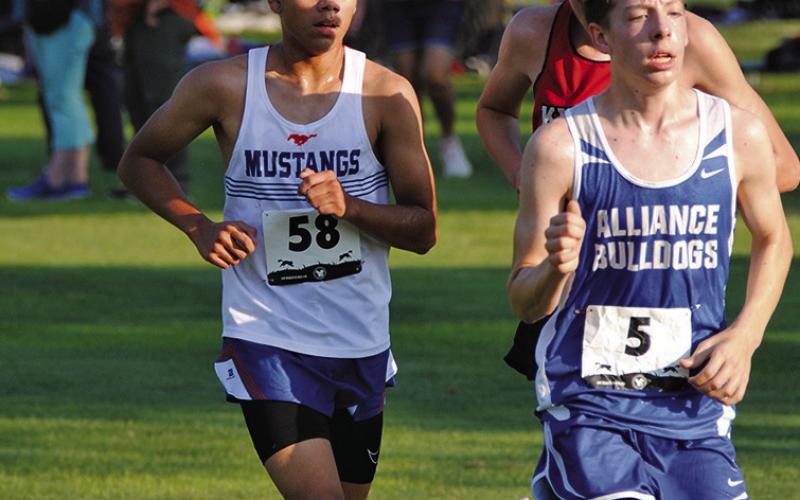 Photo by Chris Heiser Junior Eli Ross works through his first race of the year at the Panhandle Classic on Thursday, August 29. Ross would finish in 22nd place overall.