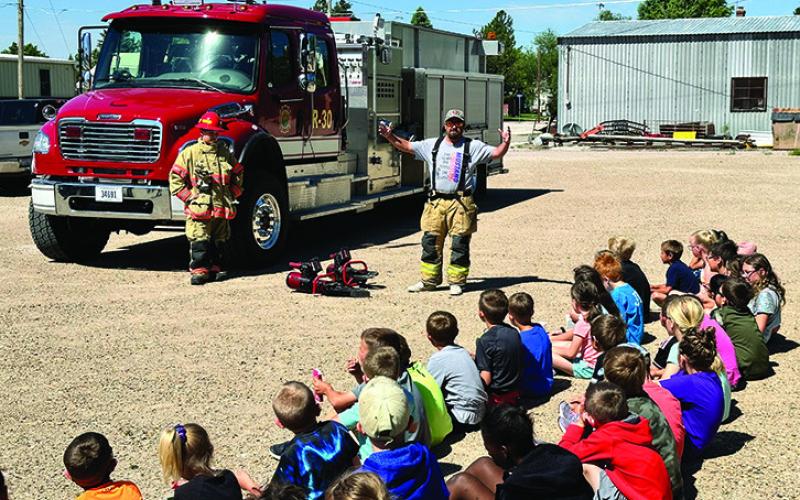Photo by Scott Bidroski The students at the STEAM program in Rushville getting a safety demonstration from the Rushville Fire Department.