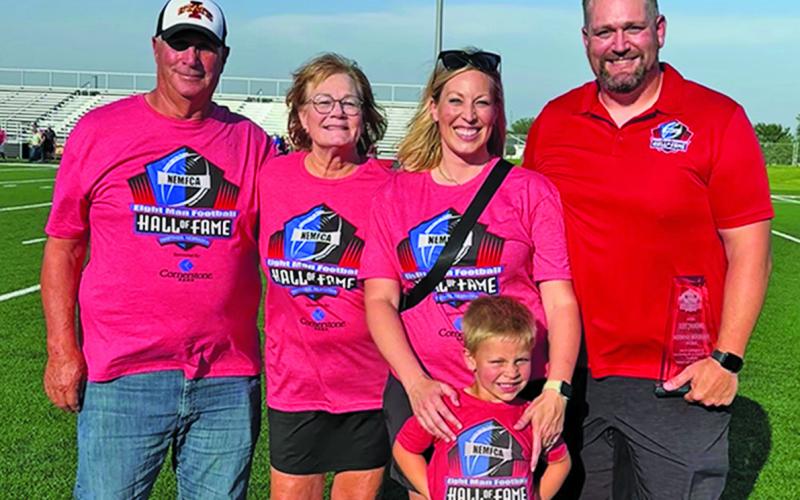 Courtesy Photo Jeff, Ronna, Abbey, Wells, and Brandon Johnson on the field in Hastings after his Eight Man Football Hall of Fame induction.