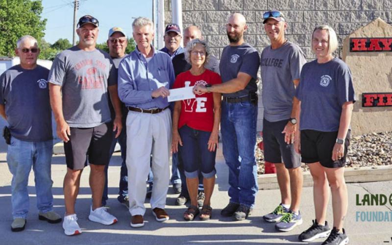 Photo by On Thursday, June 19, members of the Hay Springs Fire Department along with representatives from WESTCO presented a $40,000 check in honor of the late Randy Turman. Those pictured included: (L-R) Tim Fetter, Jeff Turman, Jerry Turman, David Briggs, Keith Kearns, Everett Langford, Betty Turman, Cole Wyatt, Ryan Turman, and Holly Scherbarth.