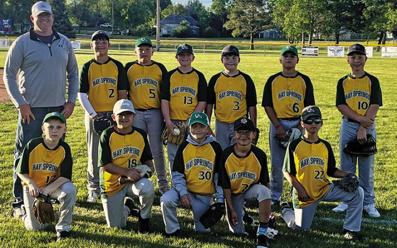 Courtesy Photo Hay Springs Cal Ripken Baseball. Front row: (L-R) Kyler Scheenan, Titus Huth, Dawson Raymer, Elijah Robb, and Max Wellnitz. Back row: Coach Greg Heiting, Duke Turman, Milo Smith, Barrett Heiting, Hudson Persons, Kort Dierksen, and Whitton Diers.
